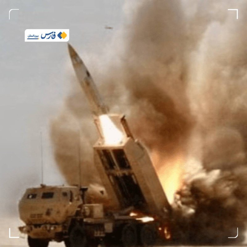 A missile launches from a mobile military vehicle, with flames and a large plume of smoke billowing into the sky.