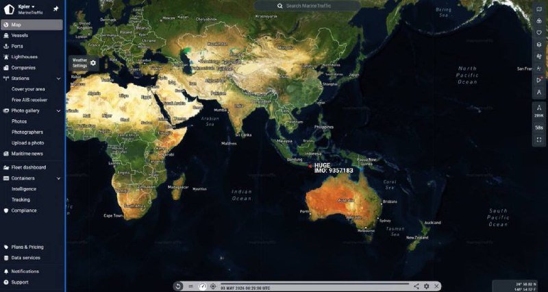 A screenshot of the MarineTraffic web application displays a satellite-style world map centered on Asia and Oceania, with a left-side navigation menu and a vessel marker labeled "HSCS" near Indonesia.