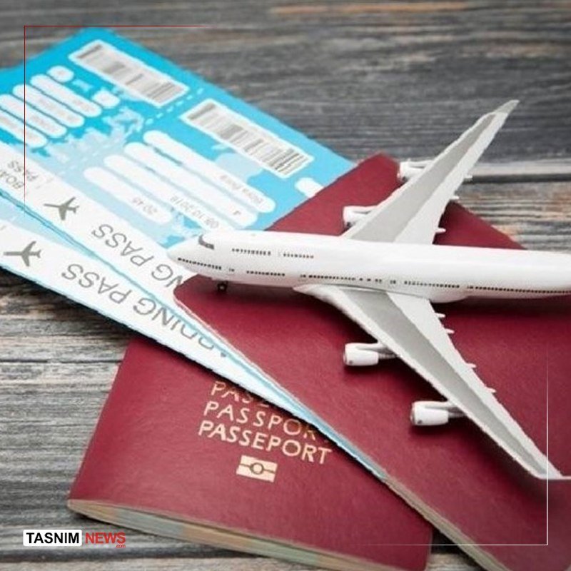 A white model airplane rests atop a burgundy passport and blue boarding passes labeled "BOARDING PASS" on a weathered wooden surface.