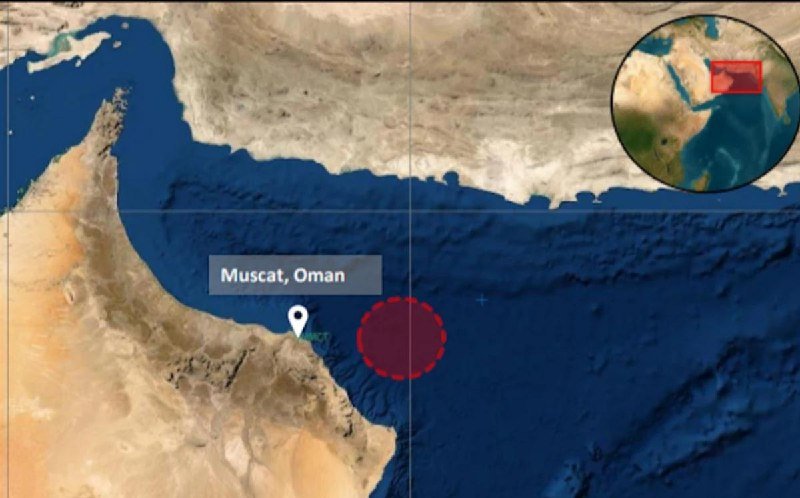A satellite map graphic shows the Arabian Peninsula with a red dashed circle off the coast near a location labeled "Muscat, Oman," alongside a small inset globe highlighting the region in red.