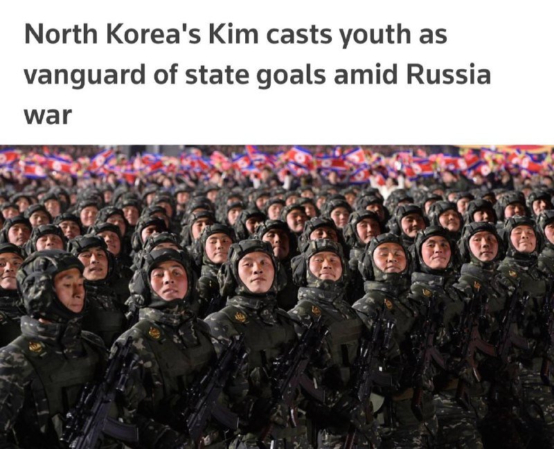 Rows of uniformed personnel in camouflage and helmets stand holding rifles beneath a headline reading "North Korea's Kim casts youth as vanguard of state goals amid Russia war."