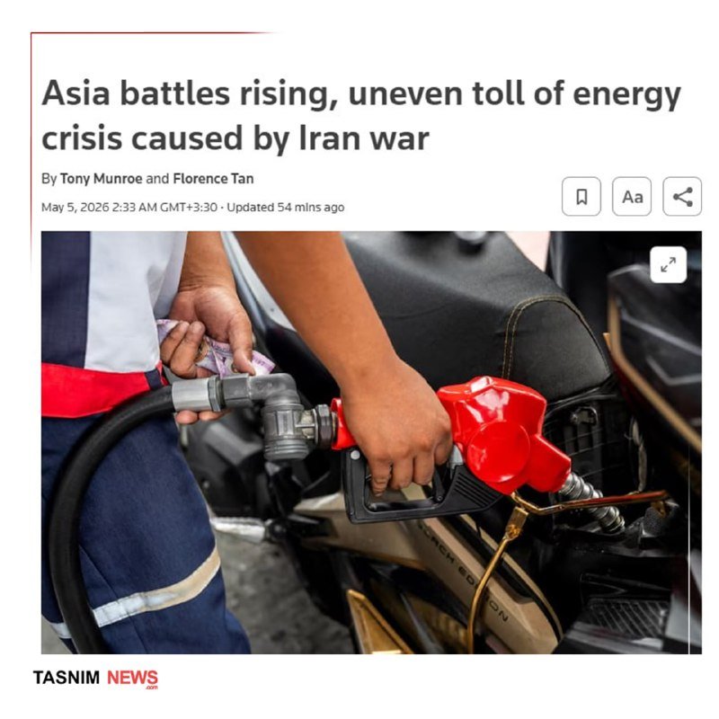A person holds currency notes while fueling a motorcycle with a red nozzle, beneath a headline about Asia's energy crisis from the Iran war.
