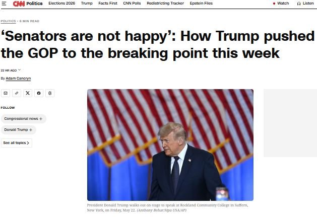 A CNN Politics webpage features a headline about senators and Trump, alongside a photo of a man in a dark suit standing before an American flag backdrop.