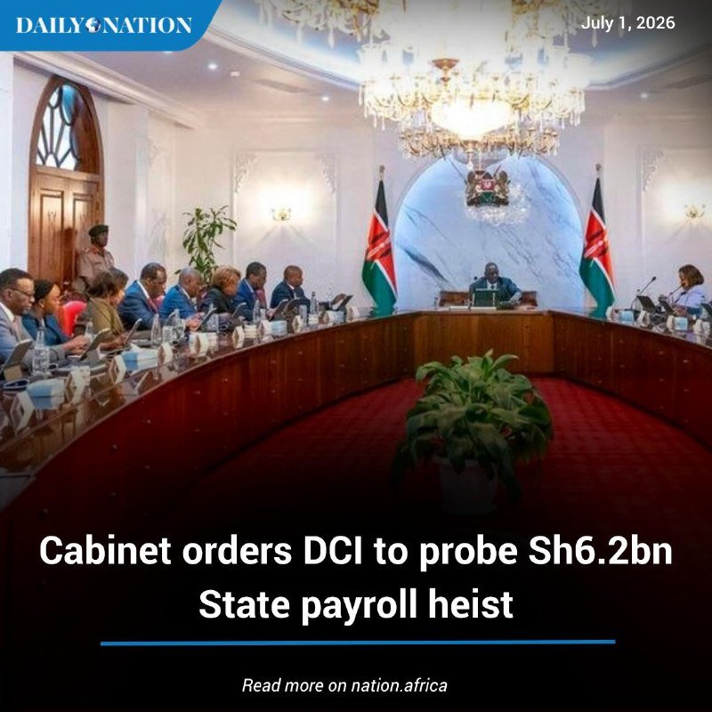 Officials seated around a curved wooden table in a chandelier-lit room, with Kenyan flags and a national emblem displayed behind the head seat.
