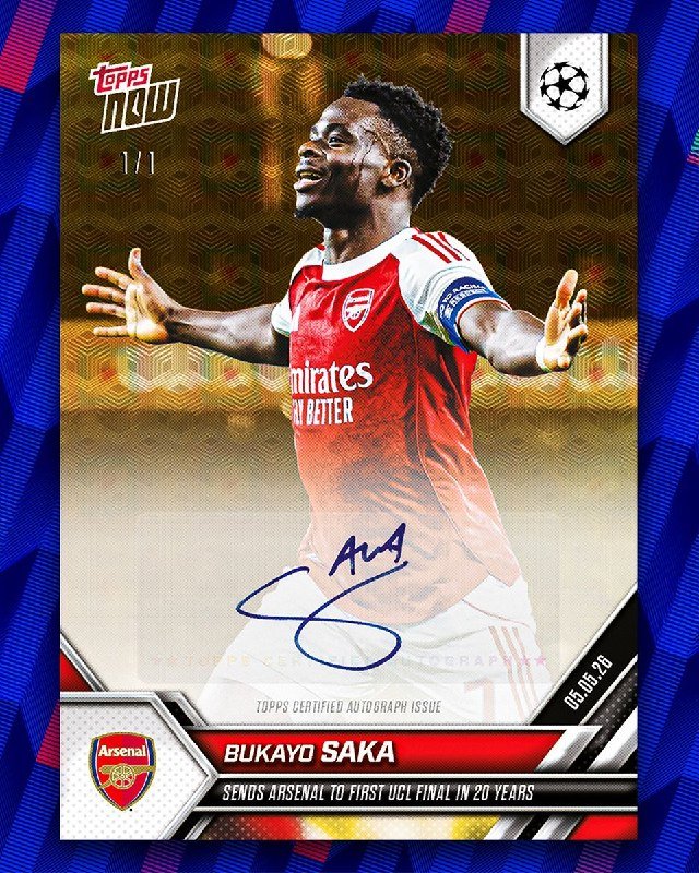 A Topps Now trading card features Arsenal footballer Bukayo Saka in a red kit with arms outstretched, bearing a blue ink autograph, Arsenal and UEFA Champions League logos, and the inscription "Sends Arsenal to first UCL final in 20 years."
