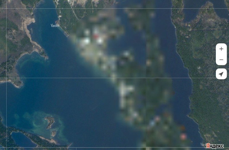 A satellite map image from Yandex shows a coastal area with a large body of water and landmasses, with the central region blurred.