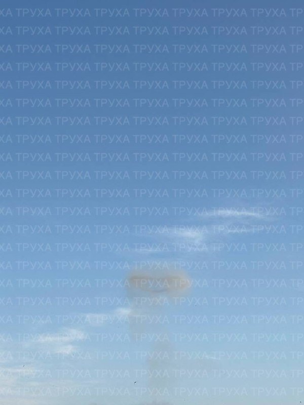 A bright blue sky with scattered white clouds, covered by a repeating "ТРУХА" watermark across the entire image.