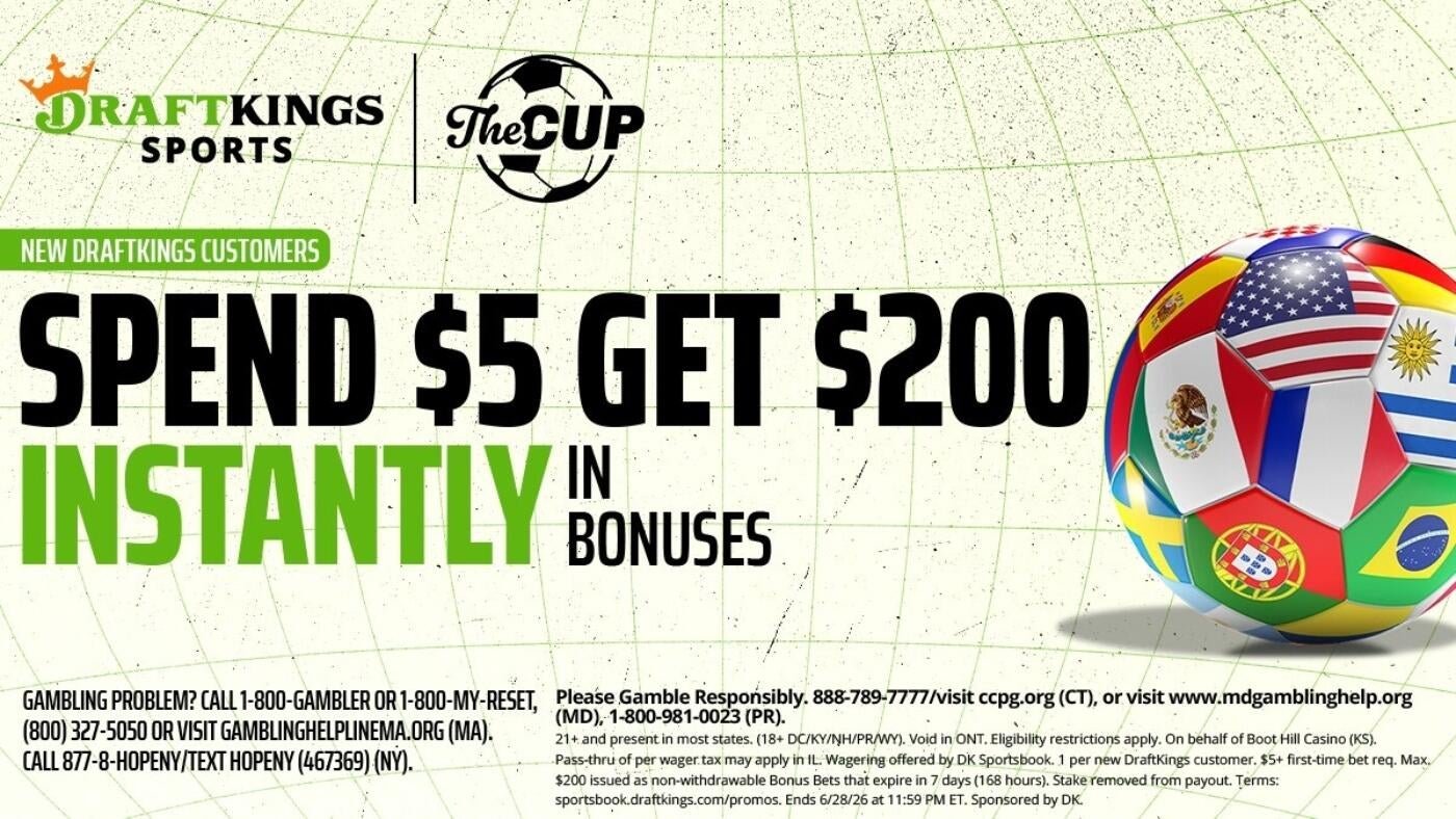 A DraftKings Sports promotional graphic advertises a "Spend $5 Get $200 Instantly in Bonuses" offer for new customers, featuring a soccer ball patterned with various national flags.