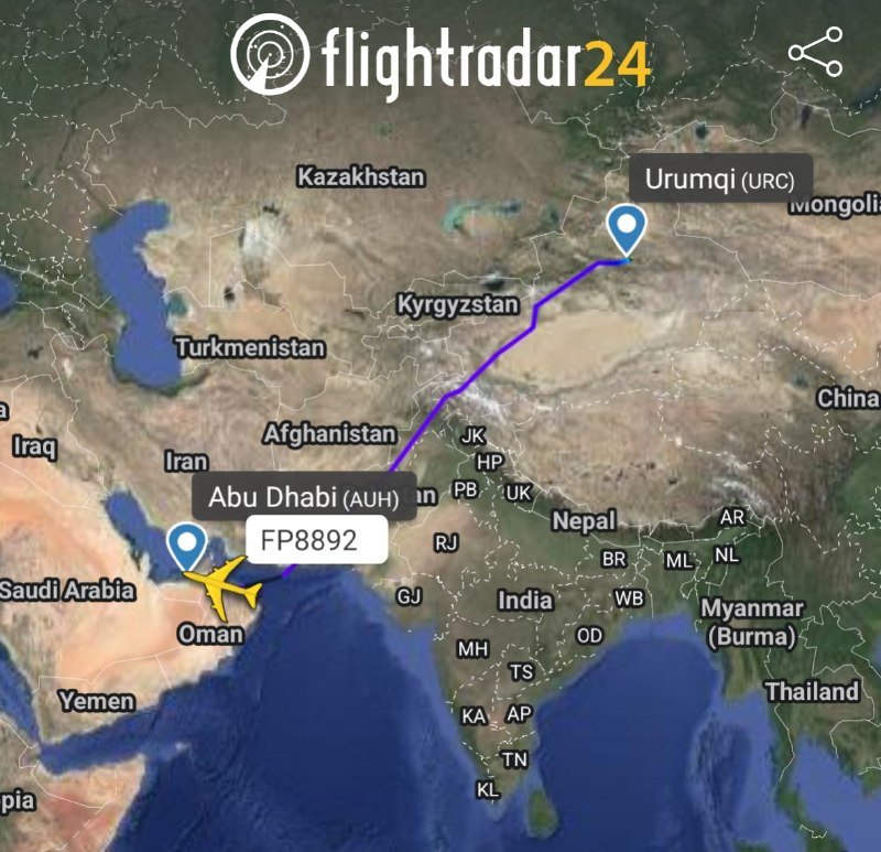 A Flightradar24 map displays a yellow airplane icon labeled "FP8892" flying from Abu Dhabi (AUH) toward Urumqi (URC) along a purple route across Central Asia.