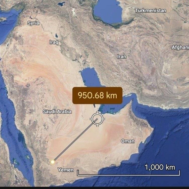 A satellite map shows a crosshair marker in Saudi Arabia connected by a line to a yellow dot in Yemen, labeled "950.68 km" with a 1,000 km scale bar.