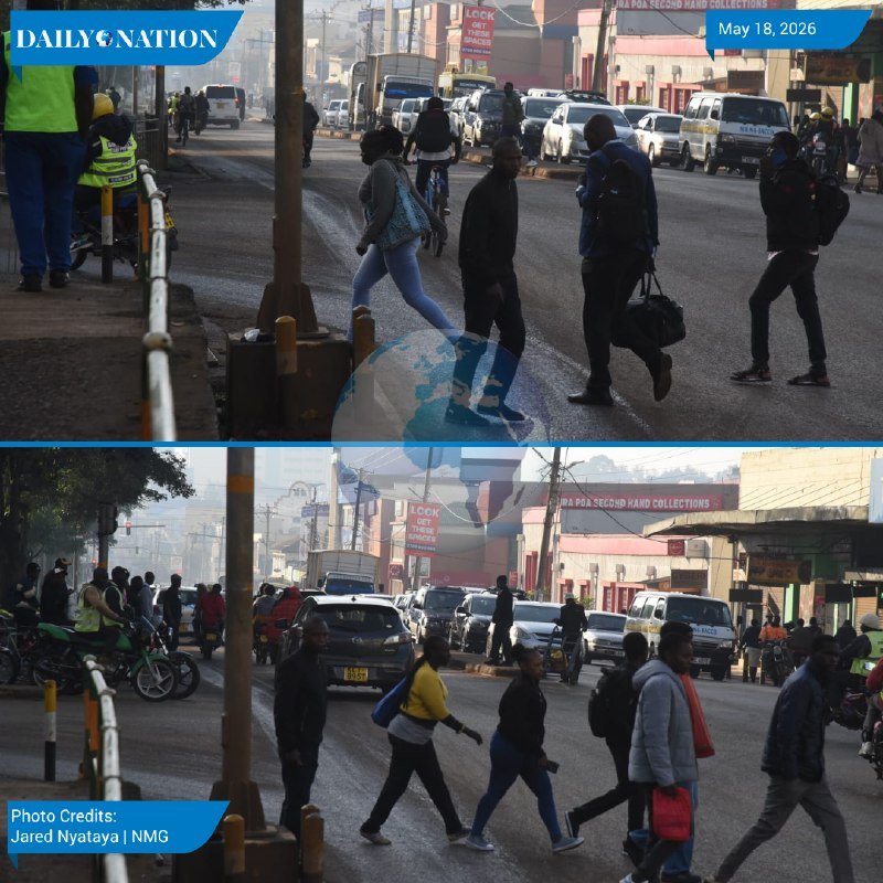 Pedestrians cross a busy street as cars, vans, and matatus navigate the road, with a "LOOK OUT FOR PEDESTRIANS" sign visible.