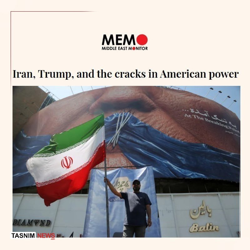 A man holds an Iranian flag in front of a billboard displaying hands breaking chains, beneath the headline "Iran, Trump, and the cracks in American power" by MEMO.