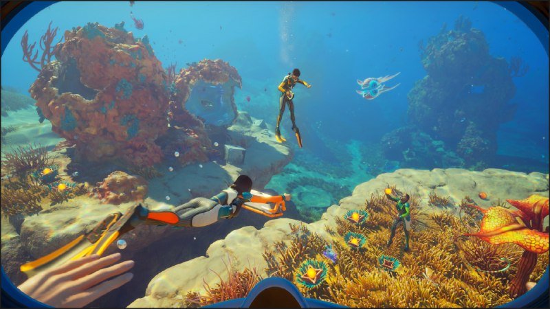 A computer-generated illustration shows snorkelers exploring a vibrant coral reef teeming with fish, sea anemones, and submerged rock formations, viewed through a diving mask.