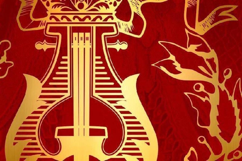 A gold lyre design is centered on a textured red background, accompanied by decorative gold leaf and floral patterns on the right side.