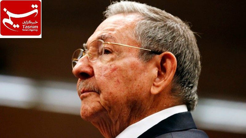 An elderly man with gray hair and glasses, wearing a dark suit, is shown in profile with a red "Tasnim News Agency" logo visible in the corner.