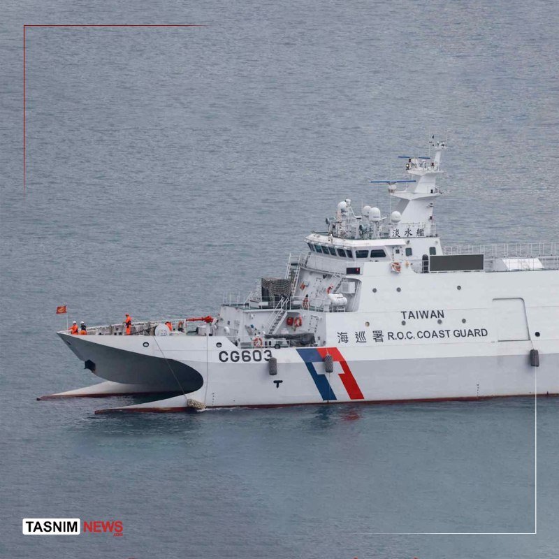 A white coast guard vessel marked "TAIWAN" and "CG603" sails on the sea, with several crew members visible on deck.