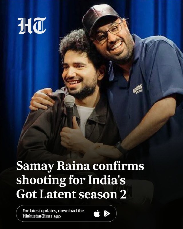 Two men smile warmly on a blue-curtained stage, one holding a microphone while the other embraces him, beneath text announcing "Samay Raina confirms shooting for India's Got Latent season 2."