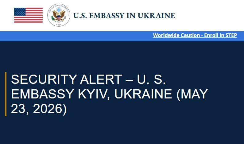 A U.S. Embassy in Ukraine graphic displays the American flag, embassy seal, and a header reading "SECURITY ALERT – U.S. EMBASSY KYIV, UKRAINE (MAY 23, 2026)."