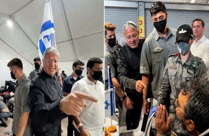 A gray-haired man in a black shirt gestures with his finger while walking beside an Israeli flag, later seen embracing a uniformed soldier and a masked young man in a tent.