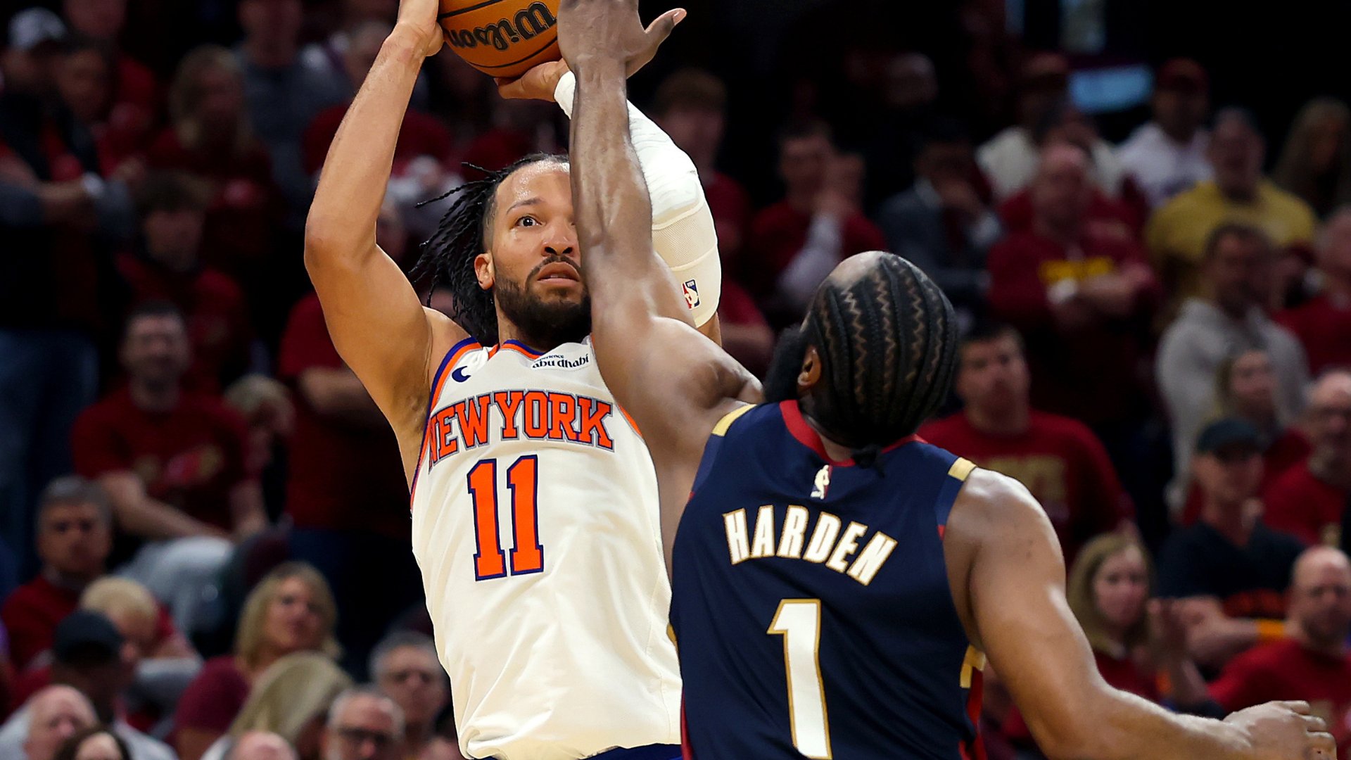 New York Knicks player #11 shoots the basketball over a defender wearing a navy jersey labeled "HARDEN 1" during an NBA game.
