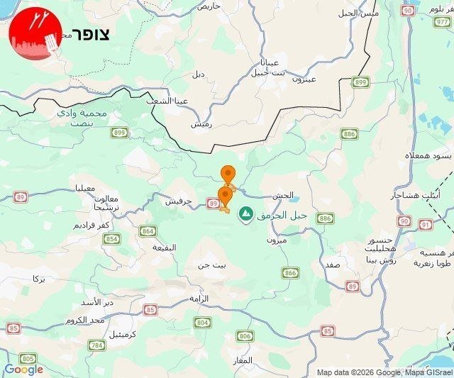 An Arabic-labeled digital map displays a region with roads, town names, and two orange location pins marking a spot near "جبل الحرمون."