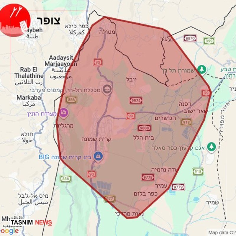 A map graphic displays a red-shaded enclosed area in northern Israel with Hebrew and Arabic place labels, overlaid with the "TASNIM NEWS" logo in the corner.