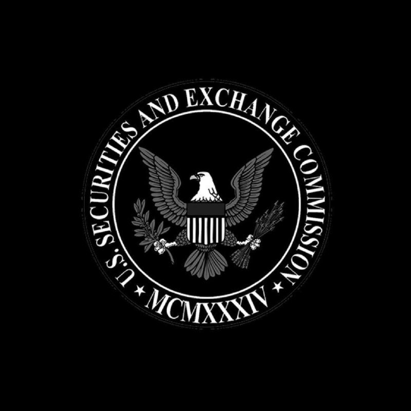 A black-and-white circular seal displays an eagle with spread wings holding an olive branch and arrows, encircled by the text "U.S. SECURITIES AND EXCHANGE COMMISSION" and "MCMXXXIV."