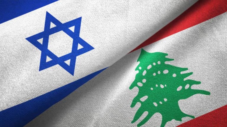 Close-up of two fabric flags, one with a blue Star of David on white and the other with a green cedar tree on red and white, overlapping diagonally.