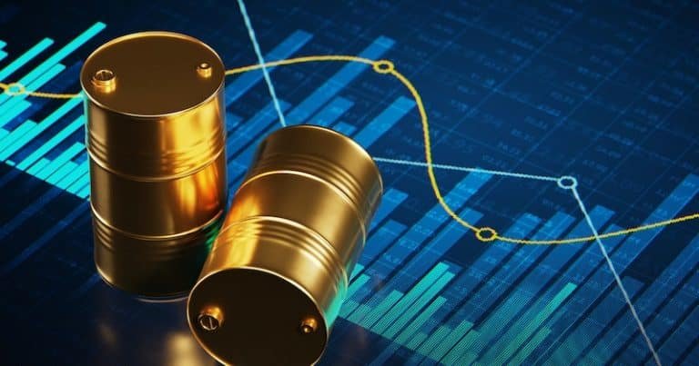 Two golden oil barrels rest on a blue digital background displaying bar graphs and a yellow line chart.