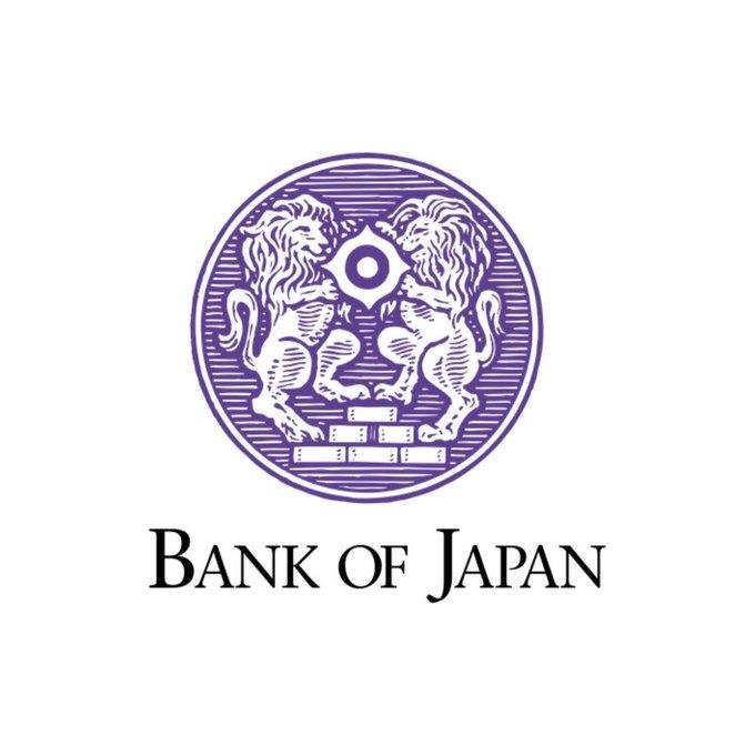 A purple circular emblem displays two facing lions flanking a central diamond shape, positioned above the text "BANK OF JAPAN" in black serif lettering.