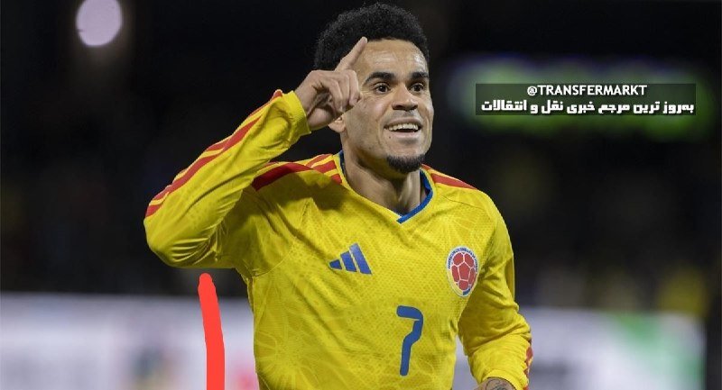 A soccer player in a yellow Colombia jersey with the number 7 points upward with his index finger during a match.