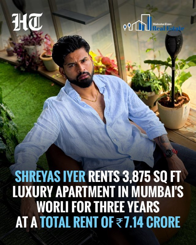 A bearded man in a light blue shirt sits on a brown sofa surrounded by potted plants, with overlaid text about renting a luxury apartment.