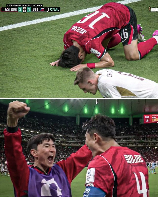 Two soccer players in red uniforms kneel on a grass field with heads bowed, while below, teammates in red and purple jerseys celebrate with raised fists inside a crowded stadium.