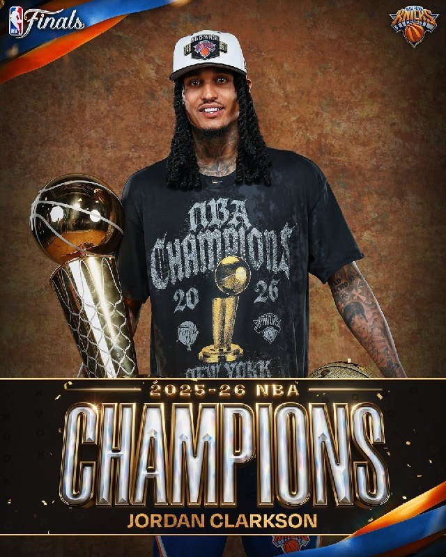 A promotional graphic shows a smiling man with long hair wearing a "2026 NBA Champions" t-shirt, standing beside a championship trophy beneath "2025-26 NBA CHAMPIONS JORDAN CLARKSON" text.