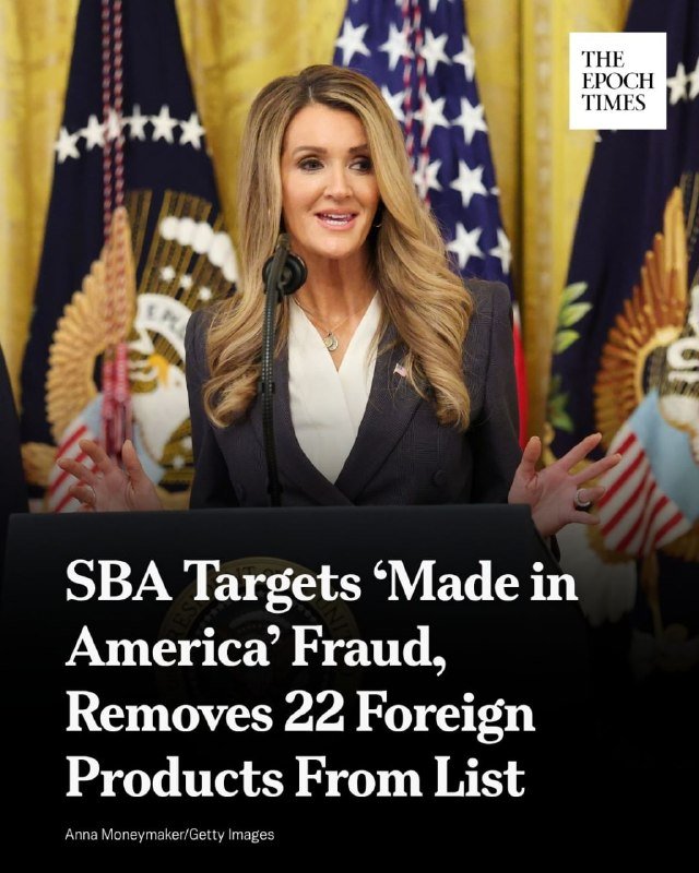 A blonde woman in a dark blazer speaks at a podium, gesturing with both hands, with U.S. flags and a presidential seal backdrop; an Epoch Times headline reads "SBA Targets 'Made in America' Fraud, Removes 22 Foreign Products From List."