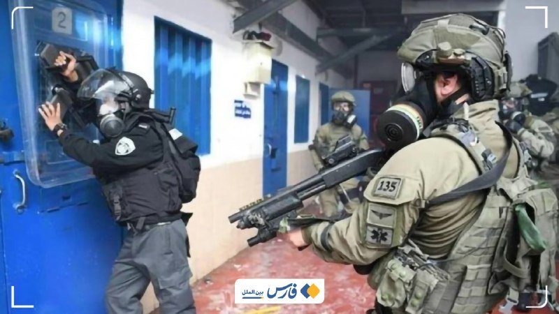 Armed personnel in gas masks and tactical gear conduct a raid inside a building with blue doors, one officer peering through a cell window marked "2."