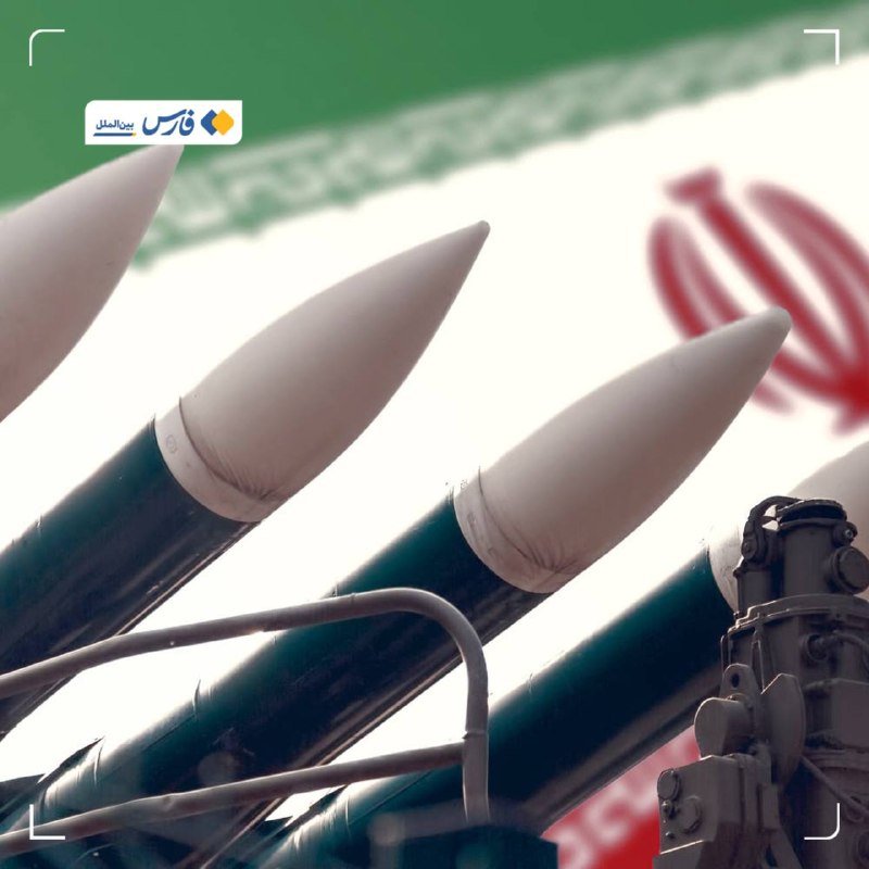 Three missiles with white nose cones and green bodies are displayed against the backdrop of an Iranian flag.