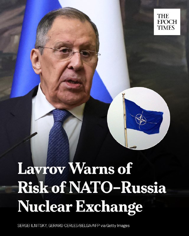 A man in a dark suit and blue tie speaks at a podium with Russian and NATO flags displayed, captioned "Lavrov Warns of Risk of NATO-Russia Nuclear Exchange" via The Epoch Times.