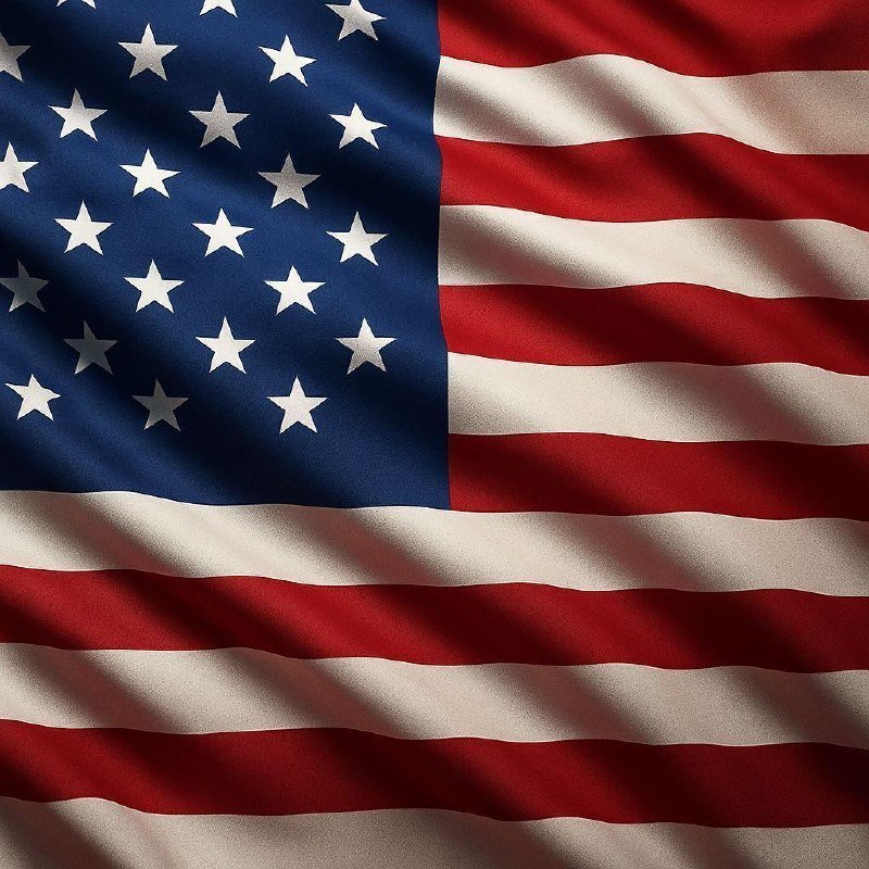 A close-up image of the American flag shows its fabric rippling, displaying a blue field of white stars and red and white stripes.