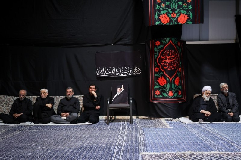 Ashura eve in Iran, photographed in front of an empty chair bearing the portrait of a supreme leader described in the source post as 'the supreme leader who was eliminated.'