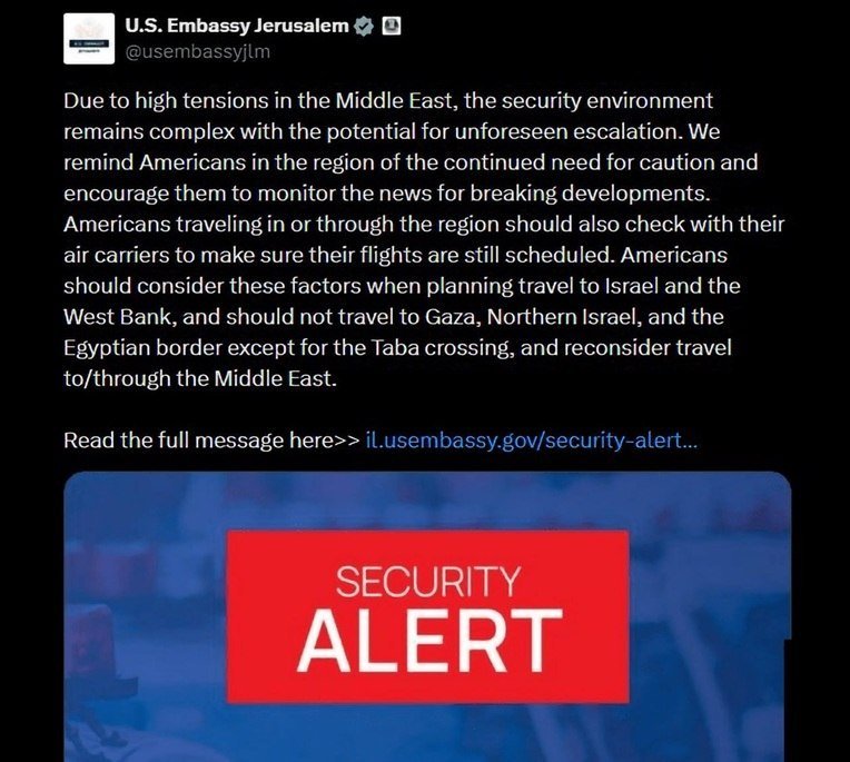 A screenshot of a U.S. Embassy Jerusalem social media post warns Americans about high tensions in the Middle East and travel restrictions, accompanied by a red "SECURITY ALERT" graphic.