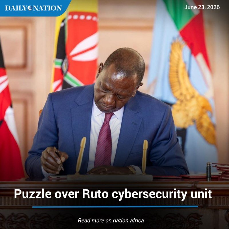 A man in a blue suit signs a document at a desk, with flags behind him, under a "Daily Nation" headline reading "Puzzle over Ruto cybersecurity unit."