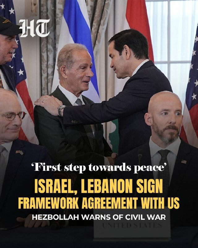 A news graphic shows suited men embracing before U.S. and Israeli flags, with text reading "'First step towards peace' — ISRAEL, LEBANON SIGN FRAMEWORK AGREEMENT WITH US."