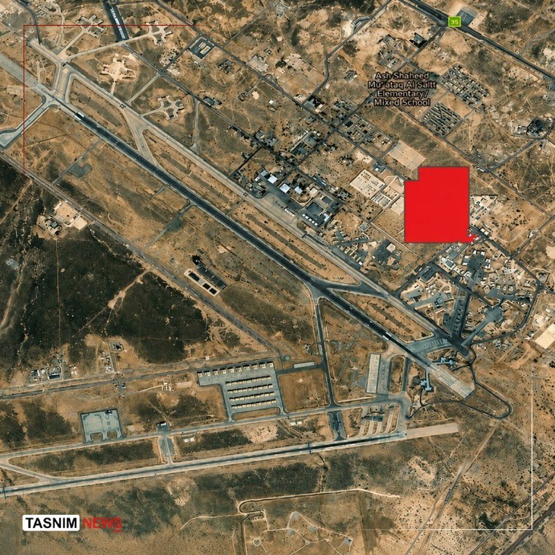 A satellite image shows a desert town with roads, buildings, and a labeled "Adh Shaheed Mustafa Al Satt Elementary/Mixed School," with a red highlighted area and "TASNIM NEWS" watermark.