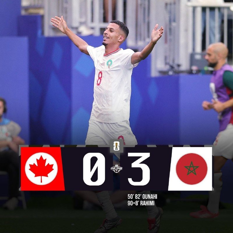 A soccer player wearing a white jersey with the number 8 raises both arms in celebration, with a scoreboard graphic showing Canada 0, Morocco 3.