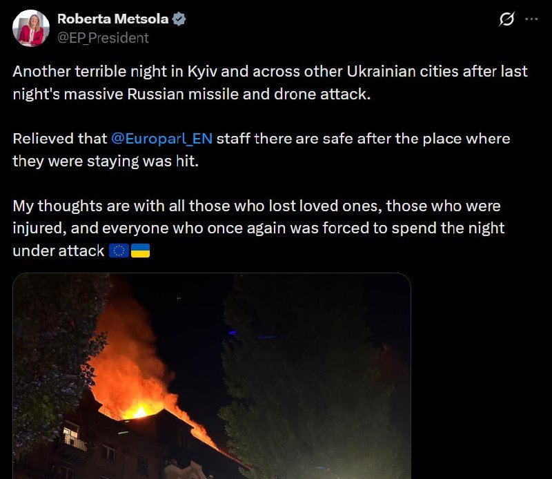 A social media post by Roberta Metsola (@EP_President) with text about attacks in Ukrainian cities, accompanied by a photo of a building engulfed in flames and smoke at night.