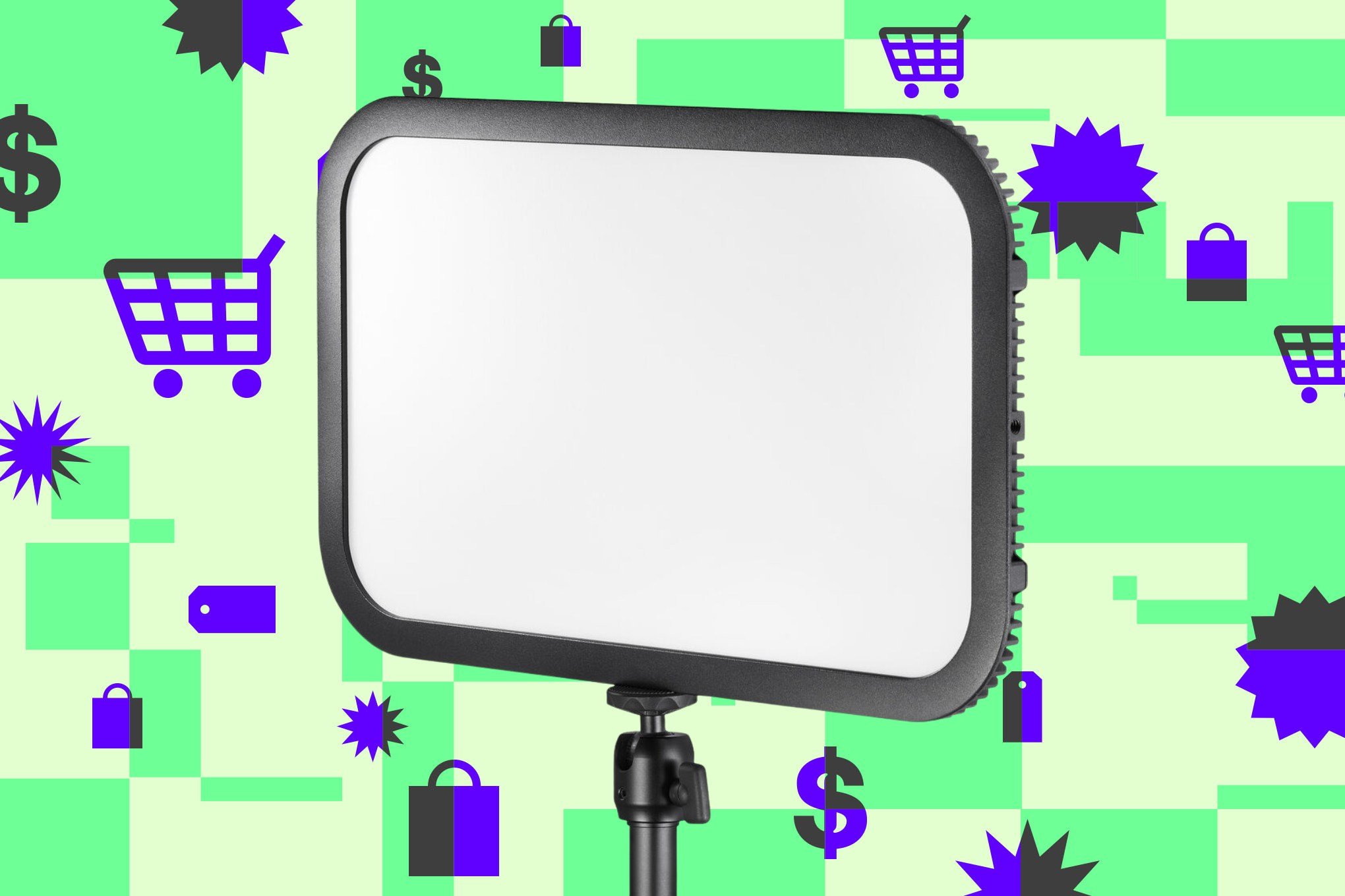 A blank LED panel light on a tripod stands centered against a green and lime checkered background patterned with purple shopping carts, dollar signs, shopping bags, price tags, and starburst graphics.