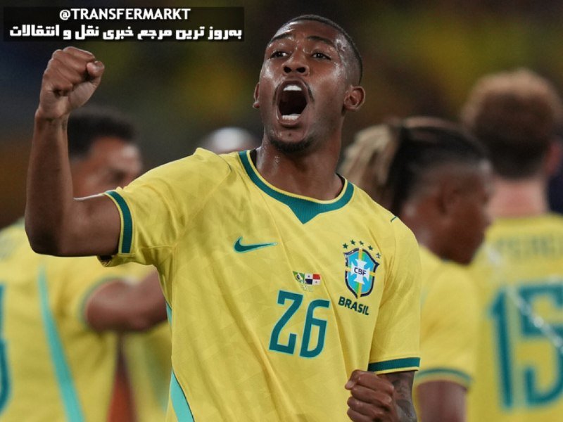 A Brazilian national team player wearing jersey number 26 celebrates with a raised fist and open mouth during a match, with teammates visible behind him.