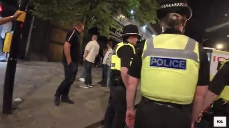 CCTV still circulating on UK Telegram channels on 5 July 2026 showing a man being dragged by officers following a single reported punch.