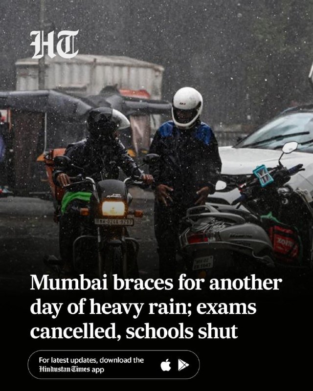 Two helmeted motorcyclists ride through heavy rain on a city street beside parked vehicles, as text reads "Mumbai braces for another day of heavy rain."